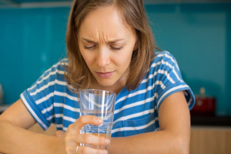 Lady Drinking Bad Tasting Water