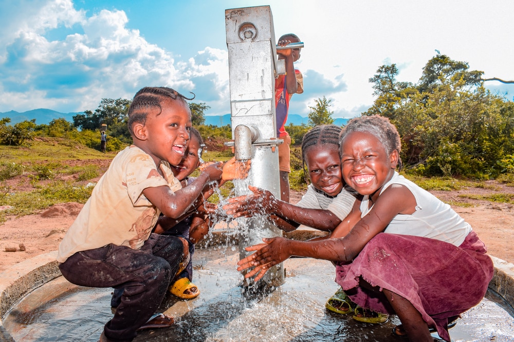 Nigerian Children Drinking Tap Water in a Rural Area