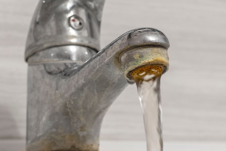 Hard water residue on a faucet