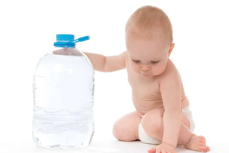 Baby holding distilled water